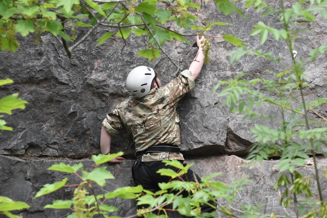 A Triffid Explorer rock climbing on a natural crag